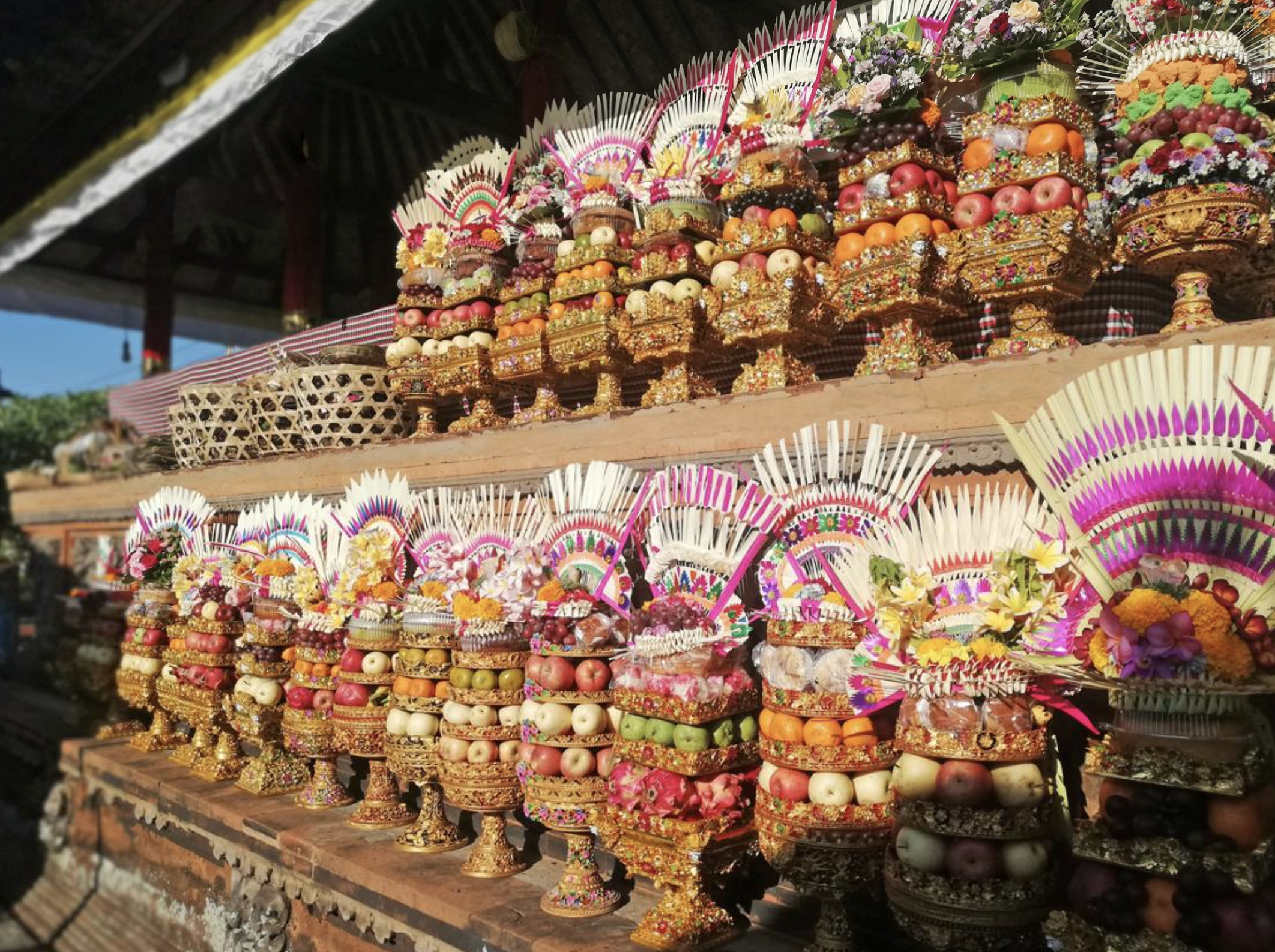 Colorful Balinese offerings with fruits and flowers arranged for a traditional Hindu ceremony in Bali